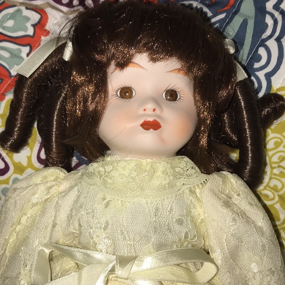 Elegant Cream Porcelain Doll with Brown Hair - Picture 2 of 7